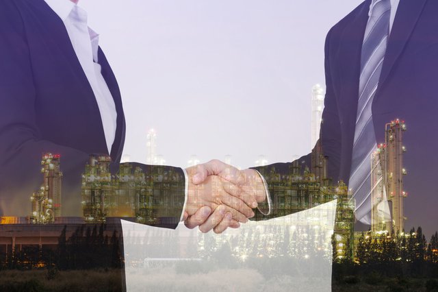 double exposure of shaking hand between businessman and business