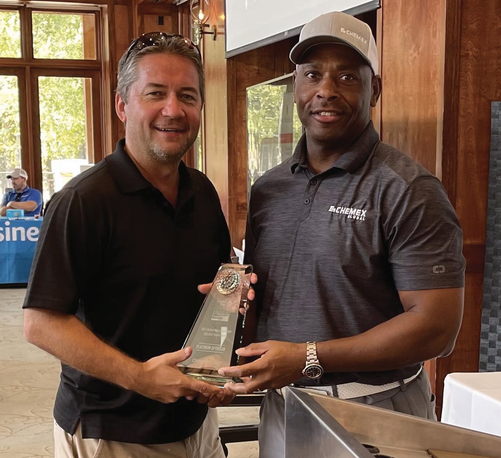 Chemex Global wins an award for Platinum Sponsorship during the ExxonMobil United Way Golf Tournament.
