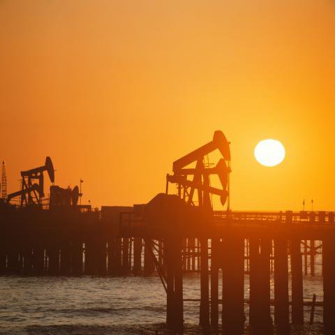 Drilling rigs at sunset.JPG